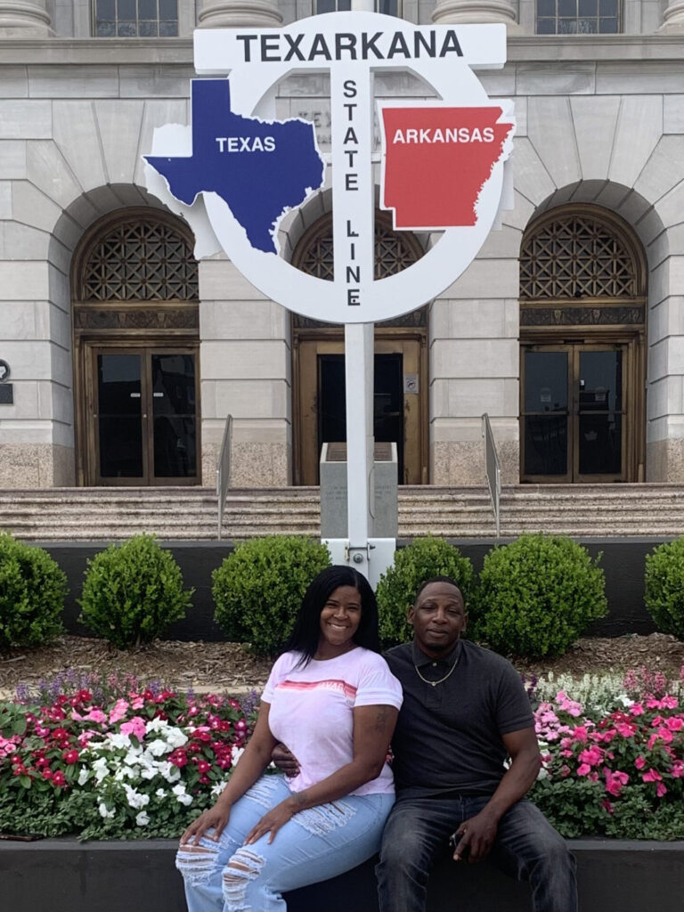 Renee and LaBarron pose together on the state line on their first trip to Texarkana together.