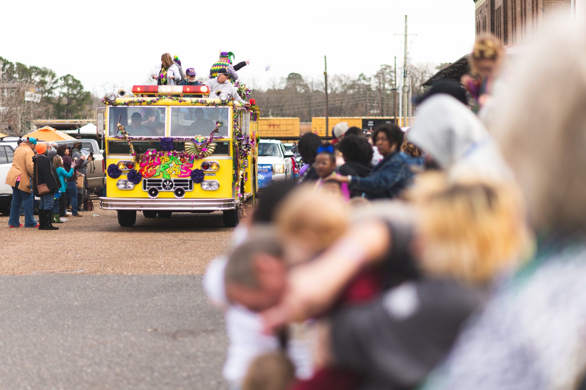 Decorated fire truck leading a Mardi Gras parade in Texarkana