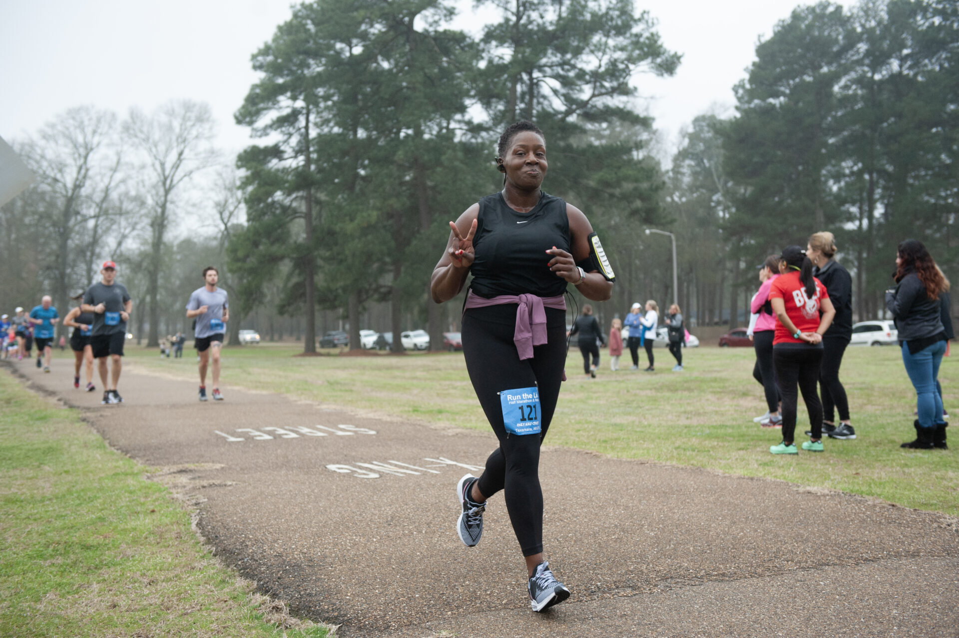 Runners make their way along a park trail during the Run the Line race.