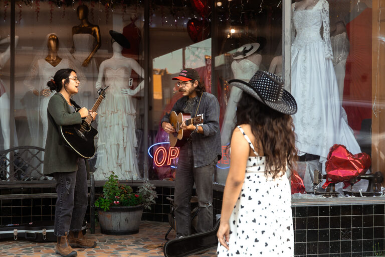 Musicians perform live outside of a dress shop in downtown Texarkana, Arkansas.
