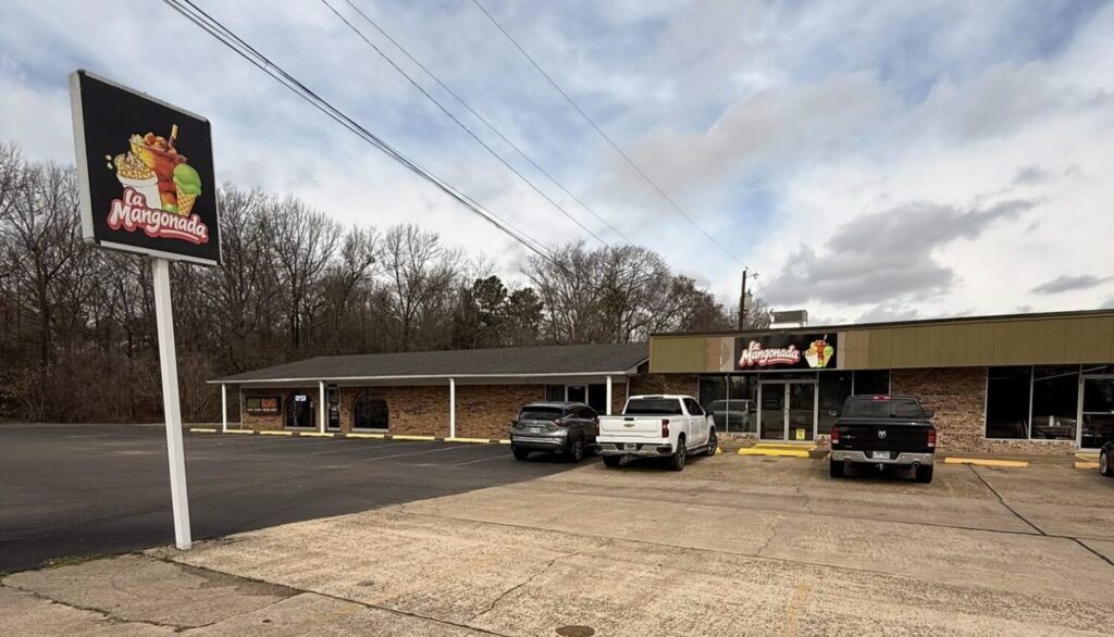 La Mangonada storefront with sign and parking lot in Texarkana.