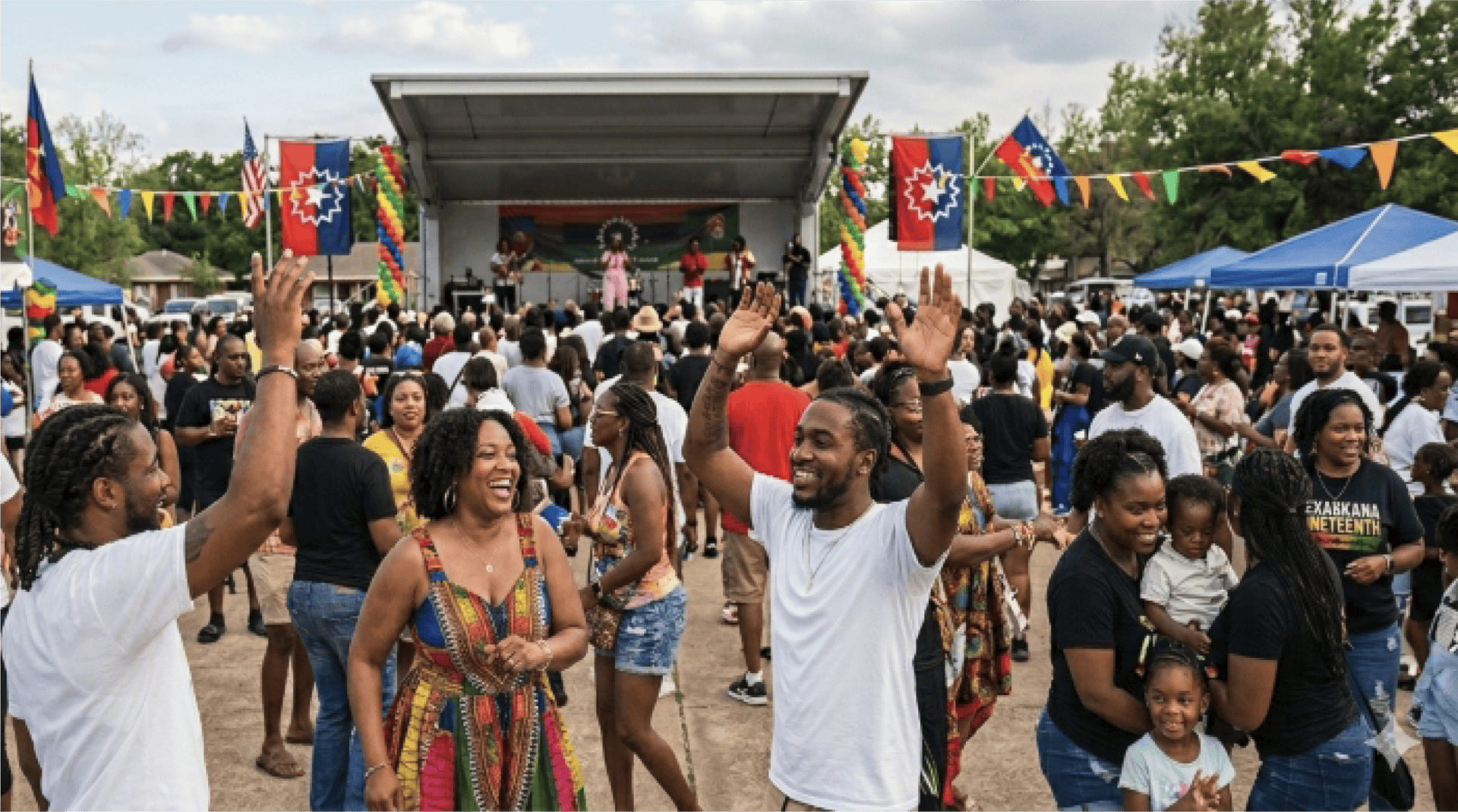 Crowd gathers for live music during the Texarkana Juneteenth Festival. 
