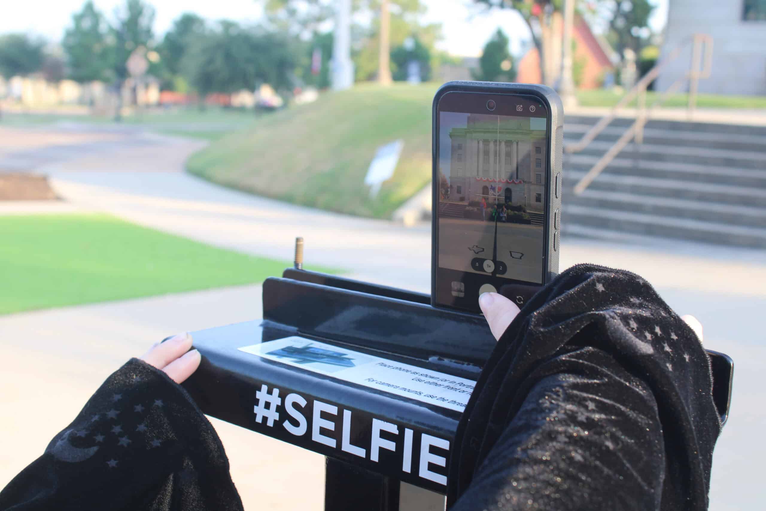 Person using the selfie stand on state line